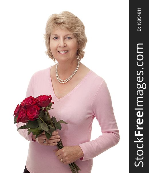 Senior Woman With Bouquet Of Red Roses