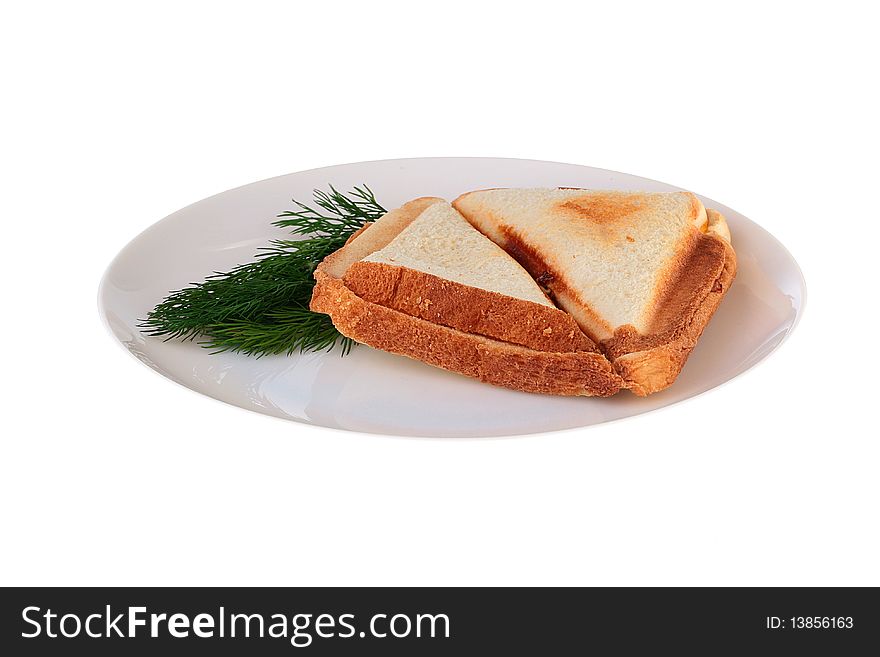 The hot sandwich is prepared in a roaster on a plate together with a fennel branch.