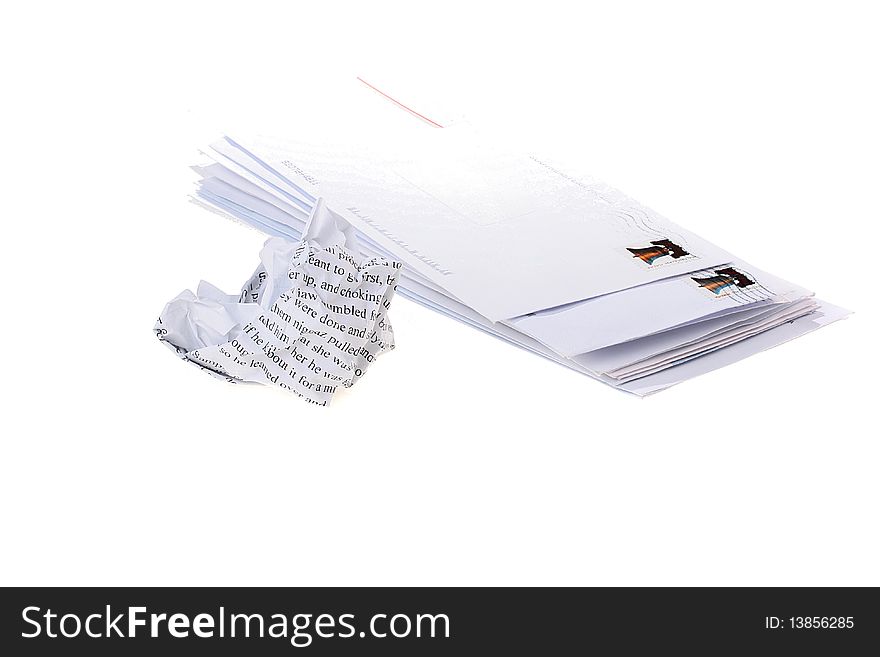 Pile of the received post envelopes and the crumpled sheet of one of letters.