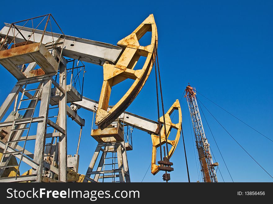 Oil pump on a background blue sky