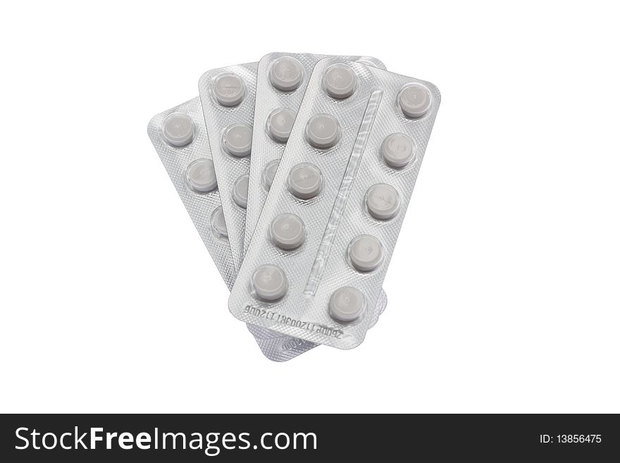 A bunch of pills isolated against white background