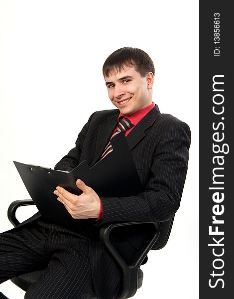Businessman sitting on chair against white background