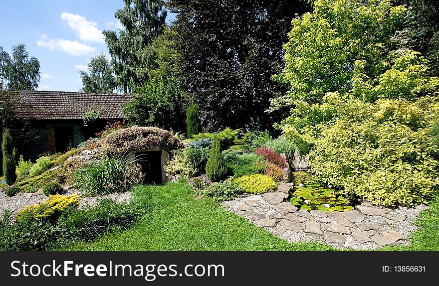 Clolorful garden with small pond