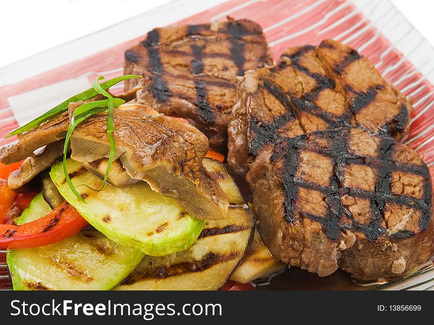 Plate with beefs fillet on white background. Plate with beefs fillet on white background
