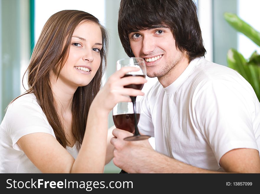 Beautiful long-haired girl and boy with wineglasses. Beautiful long-haired girl and boy with wineglasses