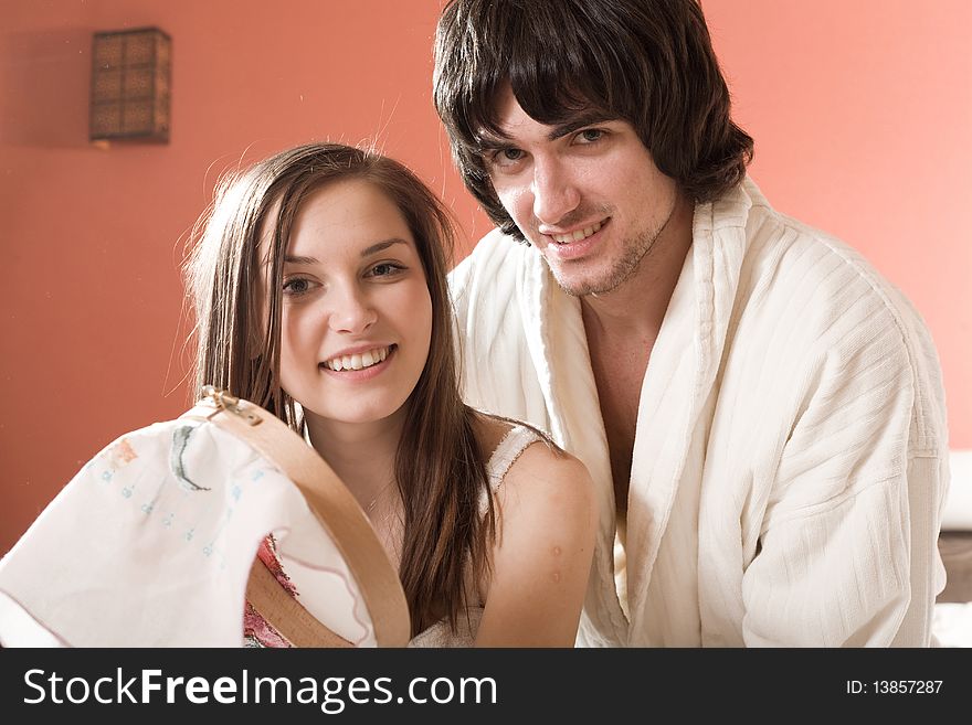 Boy in white dressing gown and girl with smile