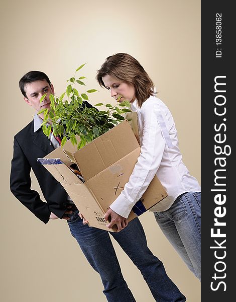 Upset Woman Leaving Office With Box