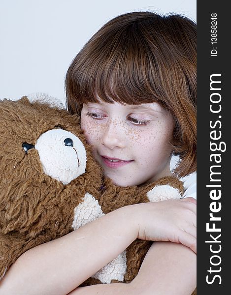 Young with teddy bear