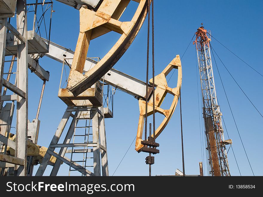 Oil pump on a background blue sky