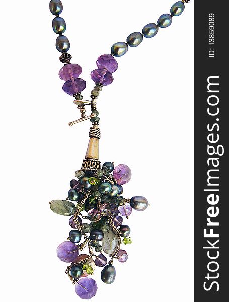 A background of a designer necklace with a amethyst stones studded in it. A background of a designer necklace with a amethyst stones studded in it.