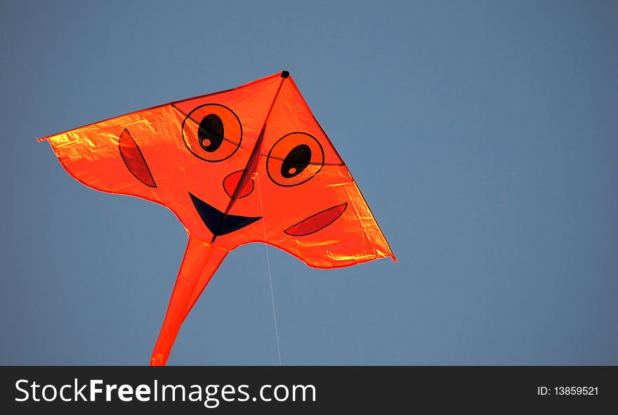 Smiling Kite With A Blue Sky Background