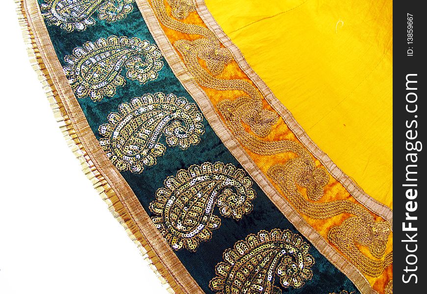 A part of heavily worked designer yellow saree which is a traditional outfit of indian women