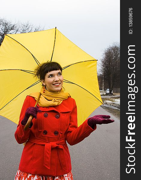 Beautiful girl on red coat with yellow. Beautiful girl on red coat with yellow