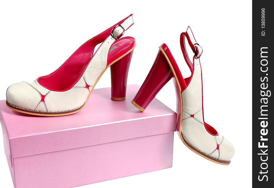 Female summer shoes of white colour and pink box from footwear