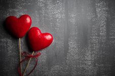 Valentines Day And Love Concept. Two Handmade Red Hearts With Red Ribbon On Gray Wooden Background Stock Photography Valentines Day And Love Concept. Two Handmade Red Hearts With Red Ribbon On Gray Wooden Background Stock Photography