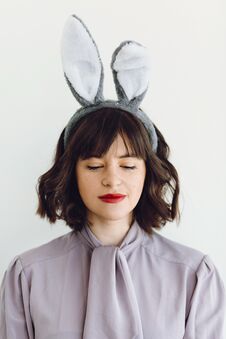 Beautiful Young Woman In Bunny Ears Calm Portrait On White Background Indoors, Space For Text. Easter Hunt Concept. Happy Easter Stock Photos