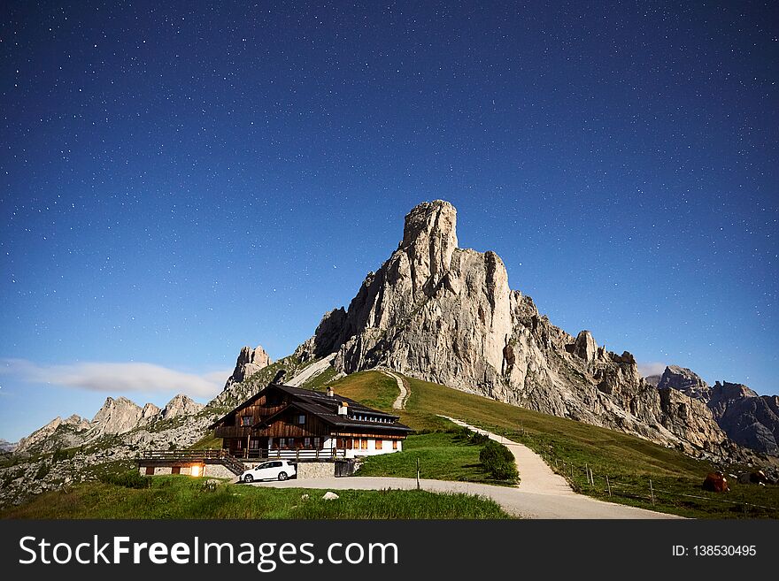 Giau Pass La Gusela mountain at blue hour in the morning. Long exposure shot with stars on sky