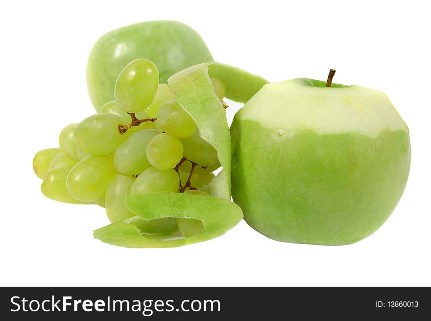 The cut Apple and grapes on a white background