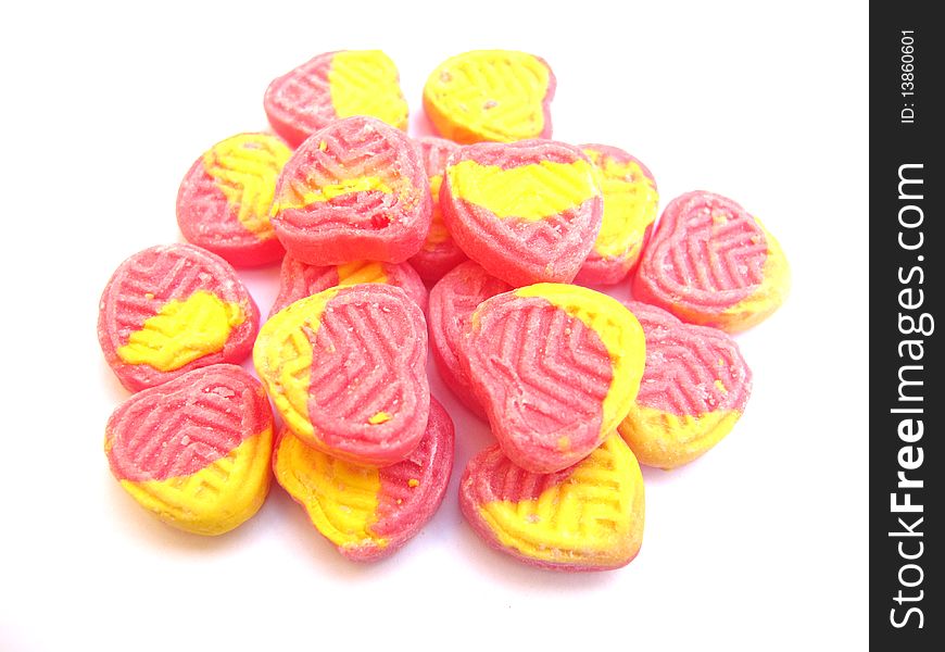 Strawberry and lemon flavored heart shape sugar candies. Strawberry and lemon flavored heart shape sugar candies.