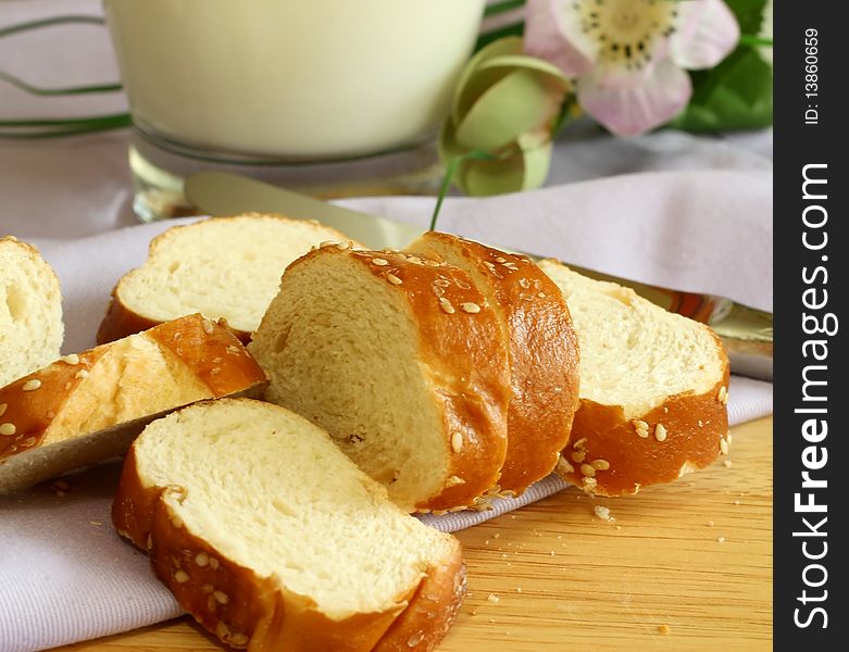 white bread with sesame on napkin on wooden