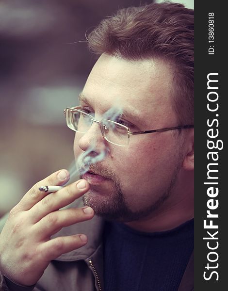 The Man Who Smokes A Cigarette