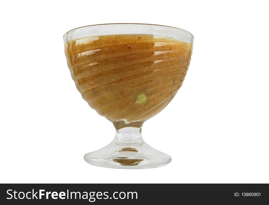 Vegetable soup puree in a glass dish on a white background