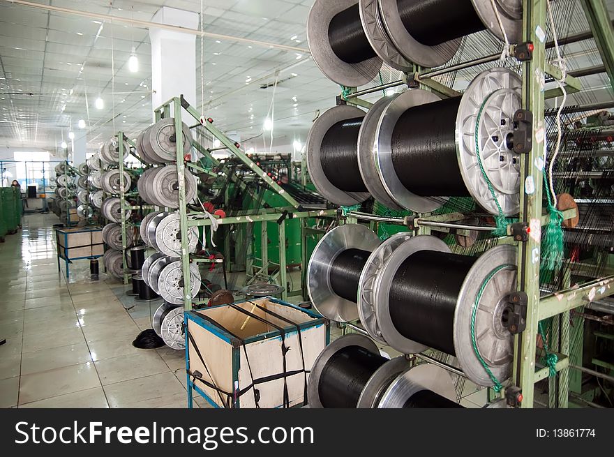 Automated textile machine and textile staff  in 
Textile Workshop , taken in china