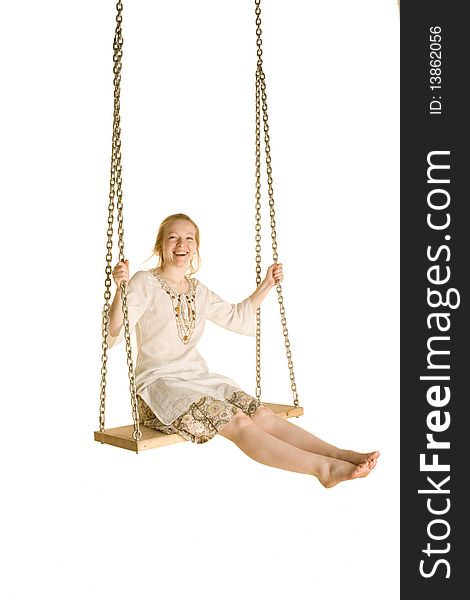 Girl on a swing on a white background