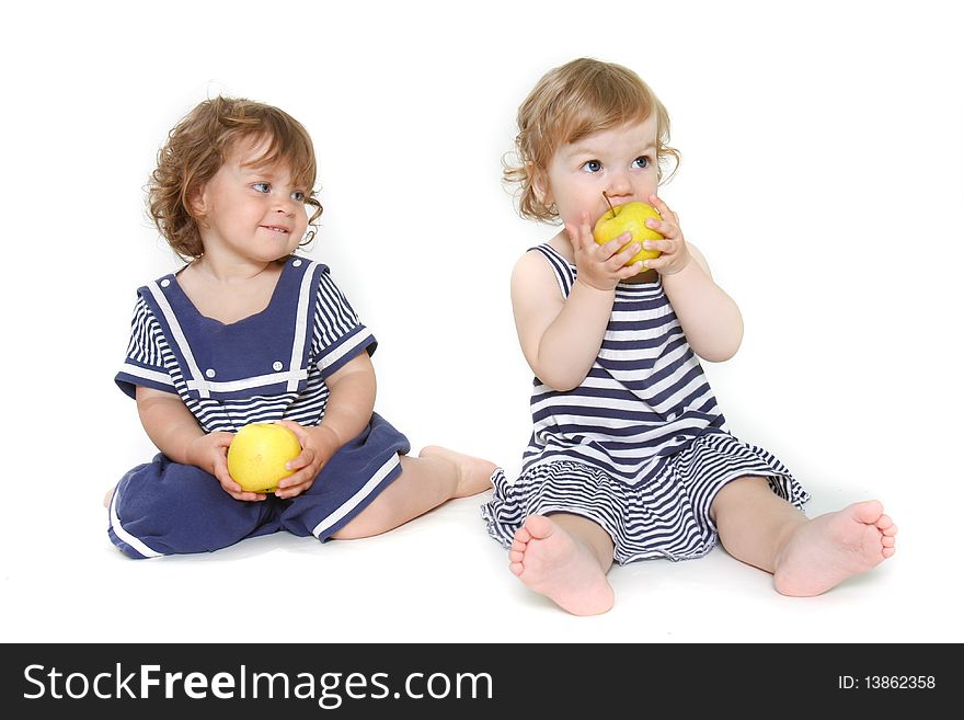 Two adorable toddler girls with green apples. Two adorable toddler girls with green apples