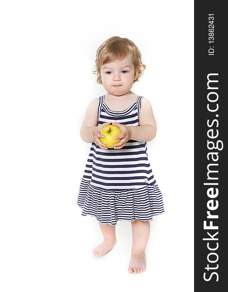 Adorable toddler girl with green apple over white