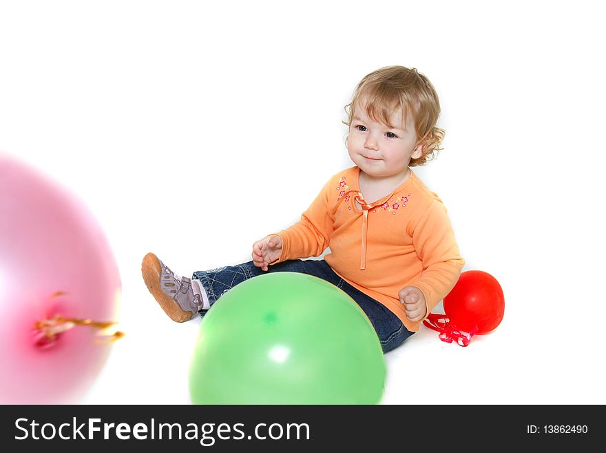 Toddler girl with colorful balloons