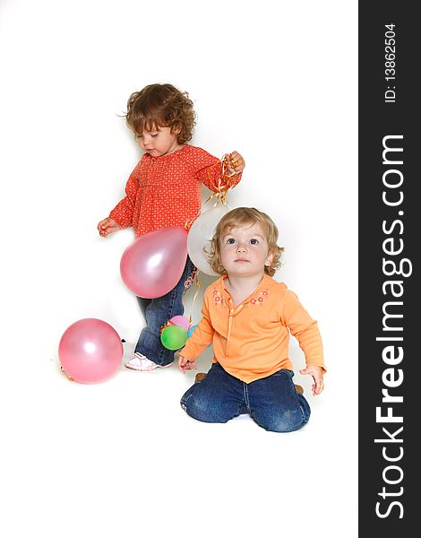 Two toddler girls with colorful balloons. Two toddler girls with colorful balloons
