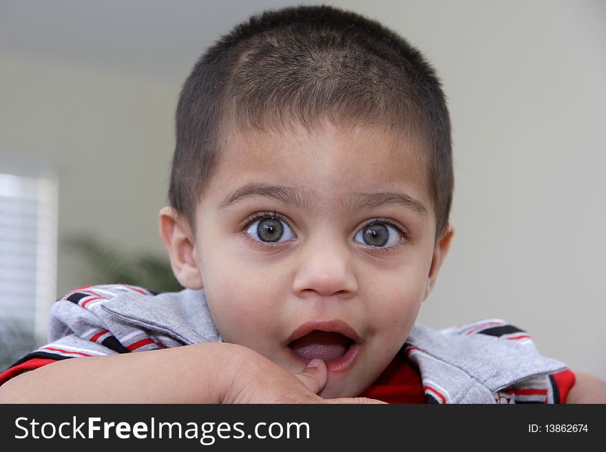 Cute Indian child with surprise face. Cute Indian child with surprise face