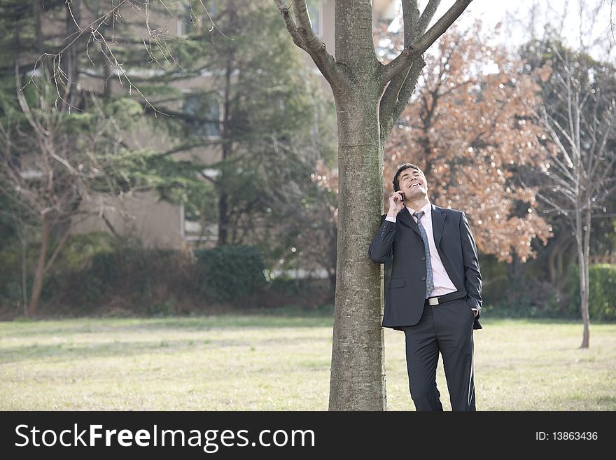 Businessman on the phone outdoors