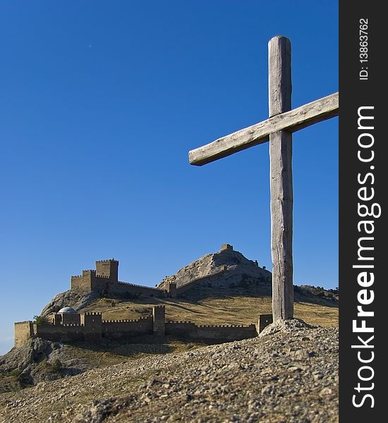 Fortress in Sudak on the background of blue sky.