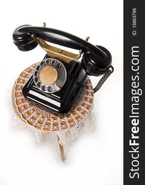 Old-fashioned phone isolated on a white background. Old-fashioned phone isolated on a white background.