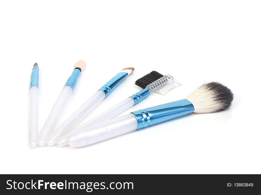 Brushes for cosmetics on a white background. Brushes for cosmetics on a white background