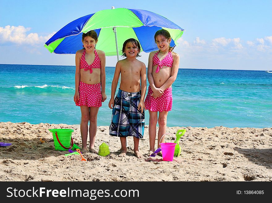 Shot of little children at the beach