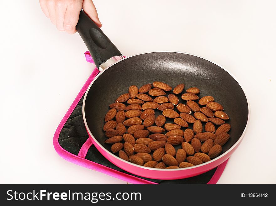 Shot of toasted almonds in a skillet