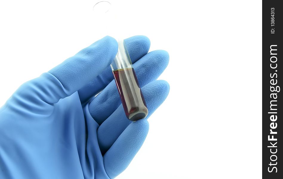 Vial with chemical in hand, laboratory workers