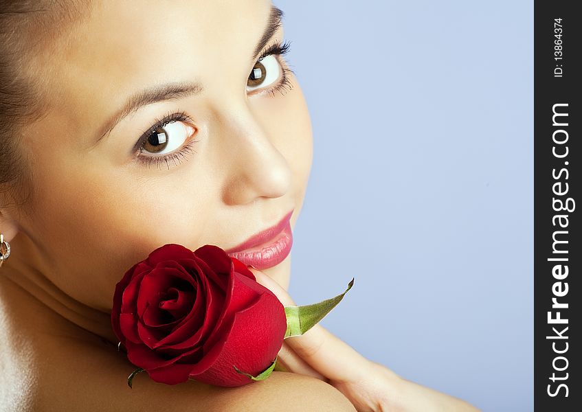 Studio portrait of sensual beautiful woman with rose. Studio portrait of sensual beautiful woman with rose