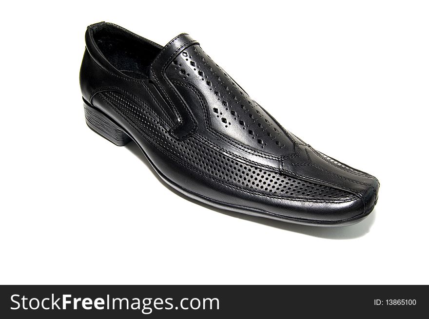 Black leather shoe over white background