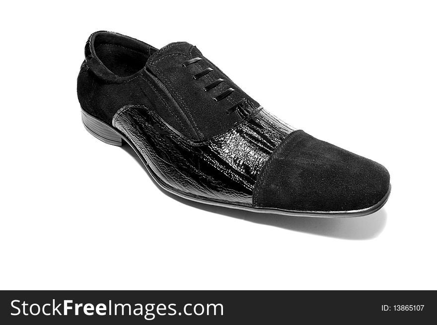 Black leather shoe over baackground