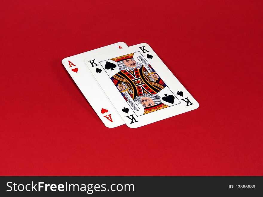Two playing cards placed on a red background. Two playing cards placed on a red background