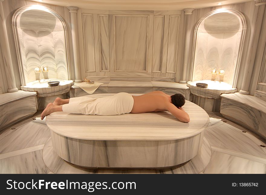 Portrait of a man lying in a room of a wellness centre