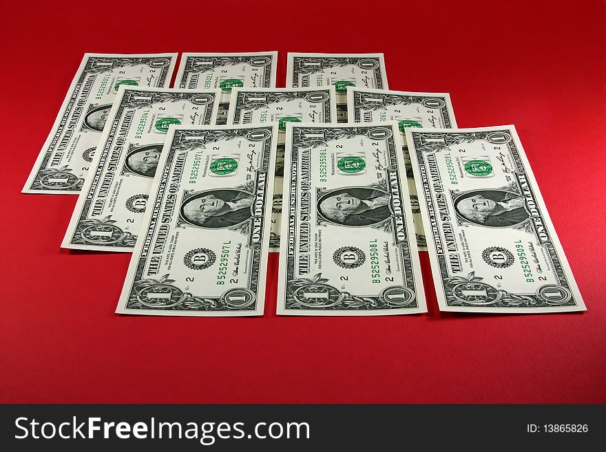 Dollars on a red background. Dollars on a red background