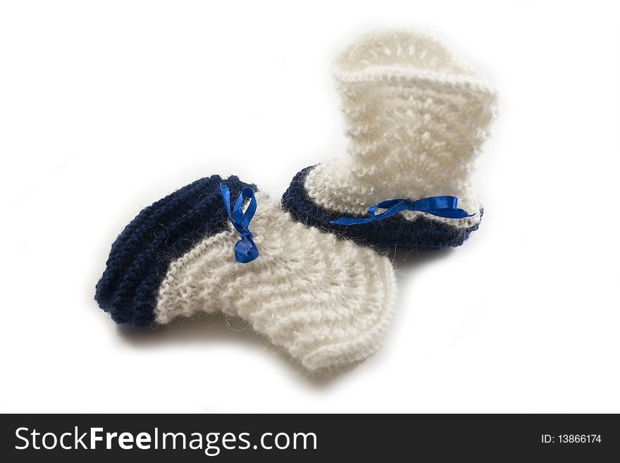 Knitted bootees delicate blue and white. Knitted bootees delicate blue and white