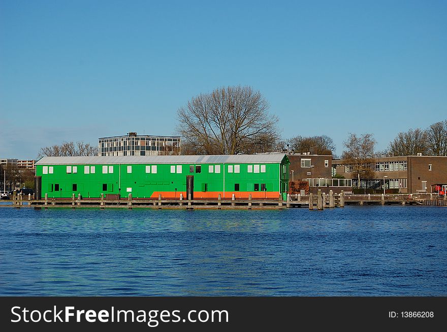 Green barn at the water