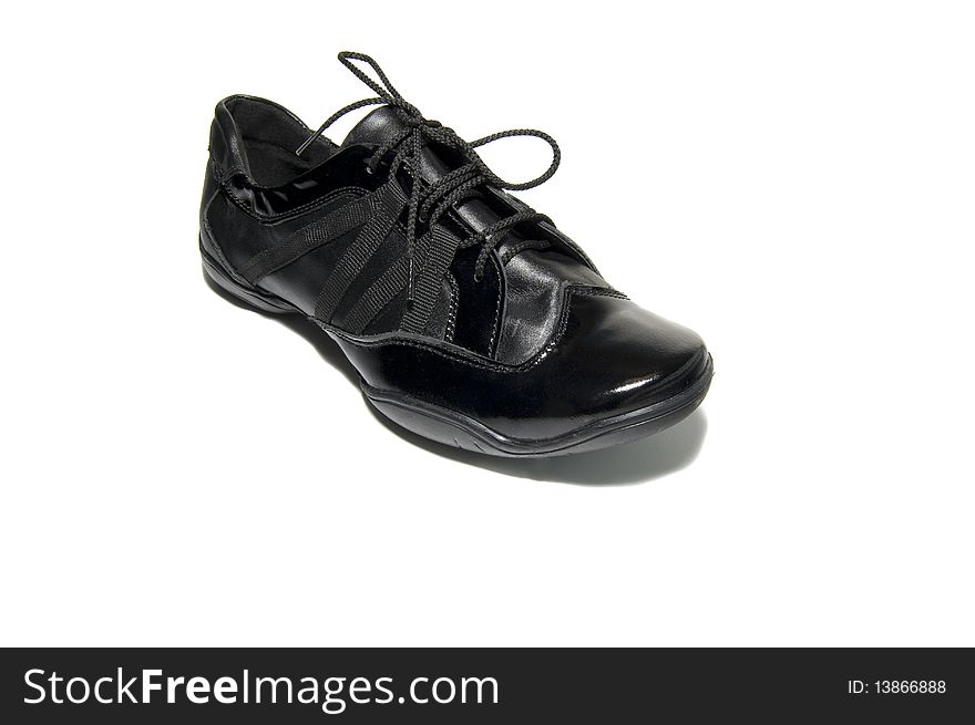 Black classical shoes over white background
