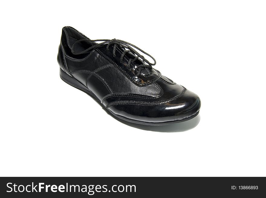 Black classical shoes over white background